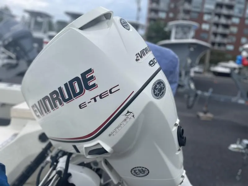 Slide: The Image of Evinrude E-TEC 90 outboard motor on a 1991 Boston Whaler 17 Outrage boat. - 7