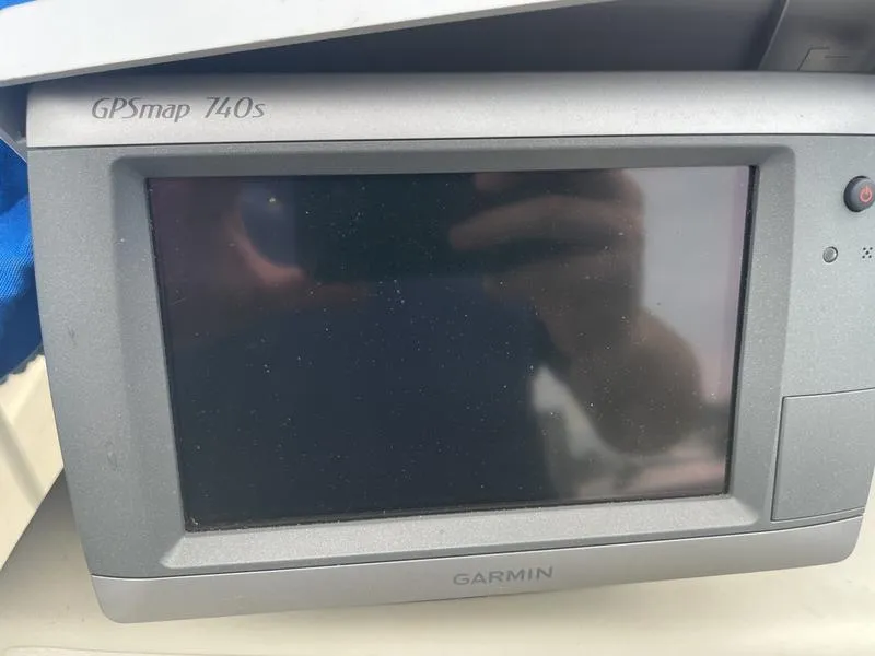 Slide: The Image of Garmin GPSmap 740s device on a 1991 Boston Whaler 17 Outrage boat. - 8