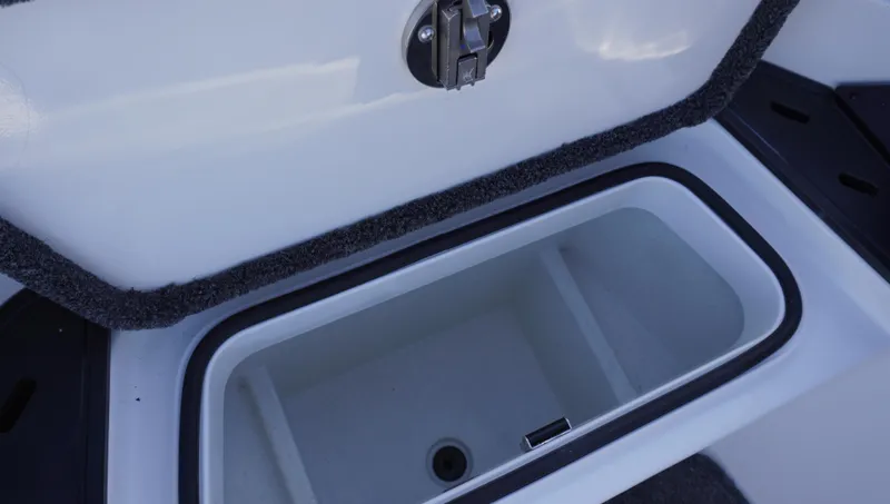 Slide: The Image of Open storage compartment in 2025 Ranger Z520 boat. - 17