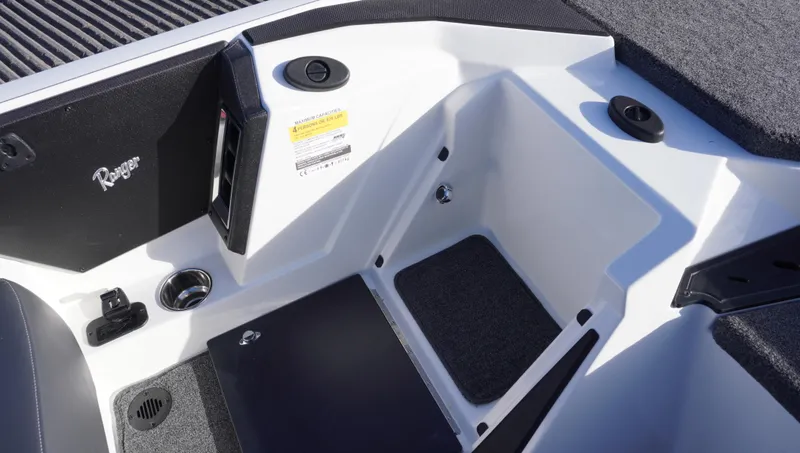 Slide: The Image of Interior view of 2025 Ranger Z520 boat, featuring storage compartments and seating area. - 18