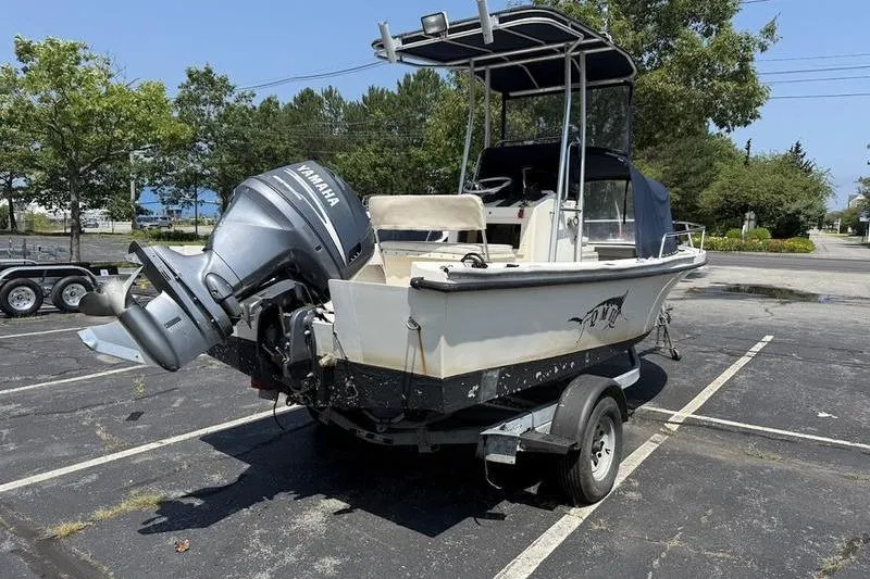 Slide: The Image of 1996 Parker 18 CC boat with Yamaha outboard motor on trailer in parking lot. - 3