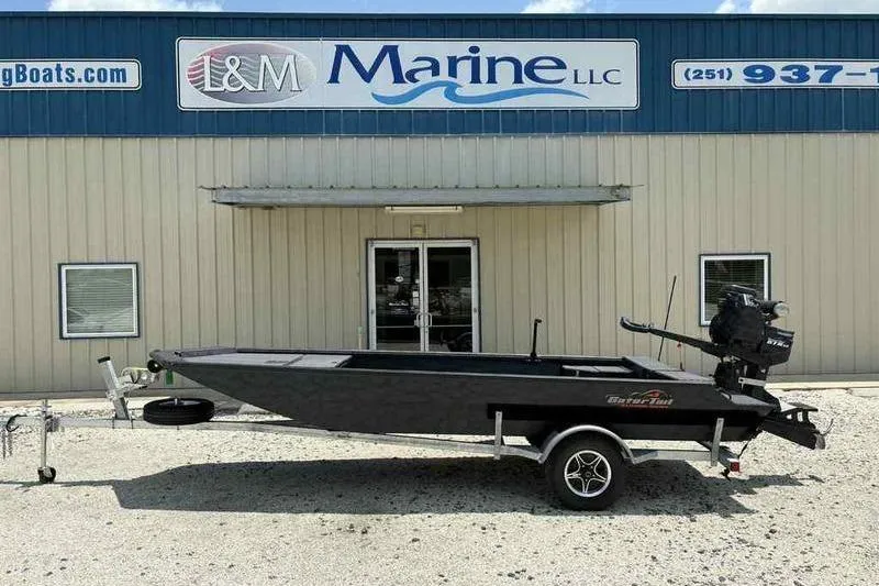 Slide: The Image of 2025 Gator Tail 1860 Extreme boat on trailer outside L&M Marine LLC. - 0