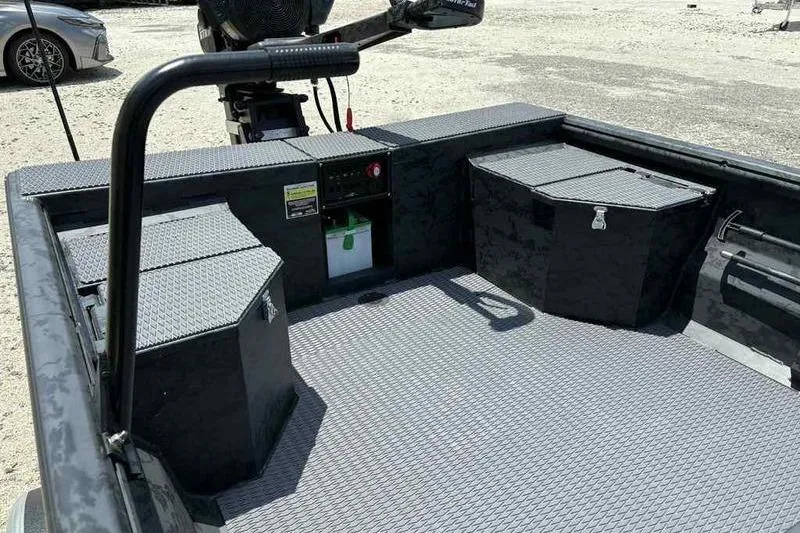 Slide: The Image of 2025 Gator Tail 1860 Extreme boat interior with storage compartments and textured flooring. - 10