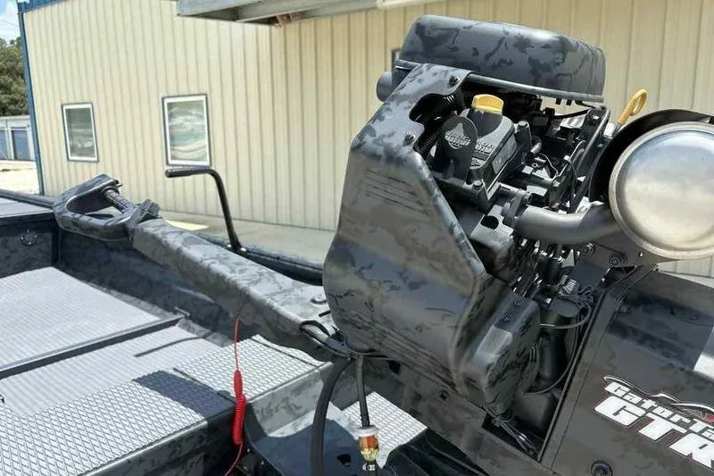 Slide: The Image of 2025 Gator Tail 1860 Extreme boat with camo design and powerful engine. - 15