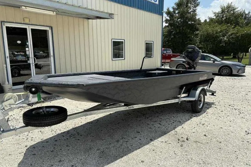Slide: The Image of 2025 Gator Tail 1860 Extreme boat on trailer outside a building. - 9