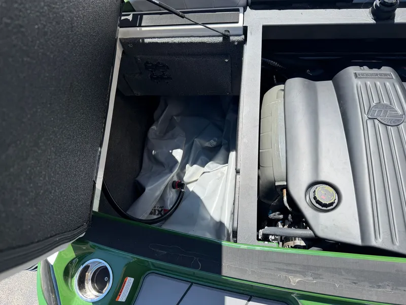 Slide: The Image of Engine compartment of a 2023 Malibu Wakesetter 20 VTX with open cover. - 16