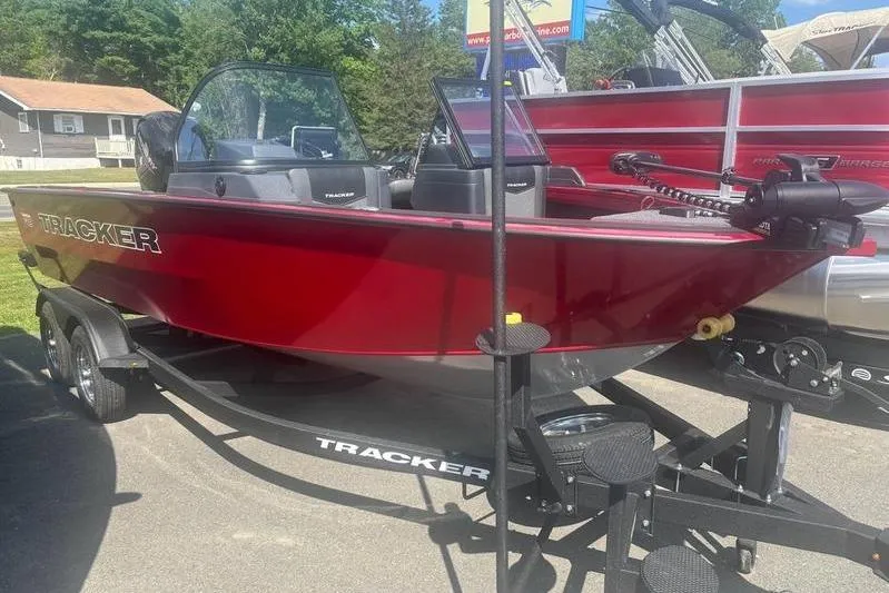 The Image of 2026 Tracker Targa V18 WT boat in vibrant red on a trailer. - 0