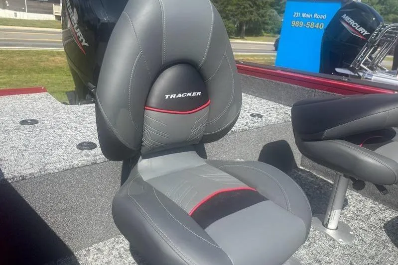 Slide: The Image of 2026 Tracker Targa V18 WT boat seat with gray and red accents. - 2