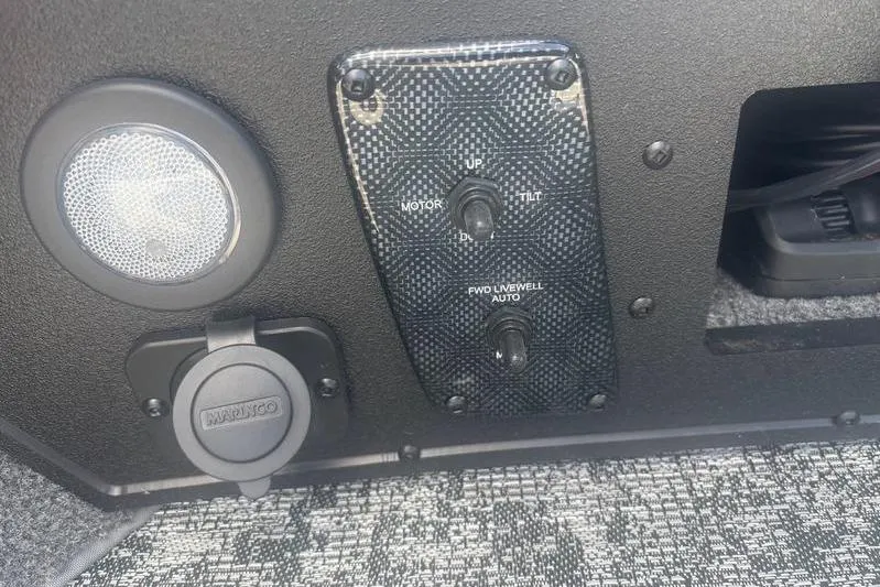 Slide: The Image of Control panel of 2026 Tracker Targa V18 WT boat with switches and speaker. - 5