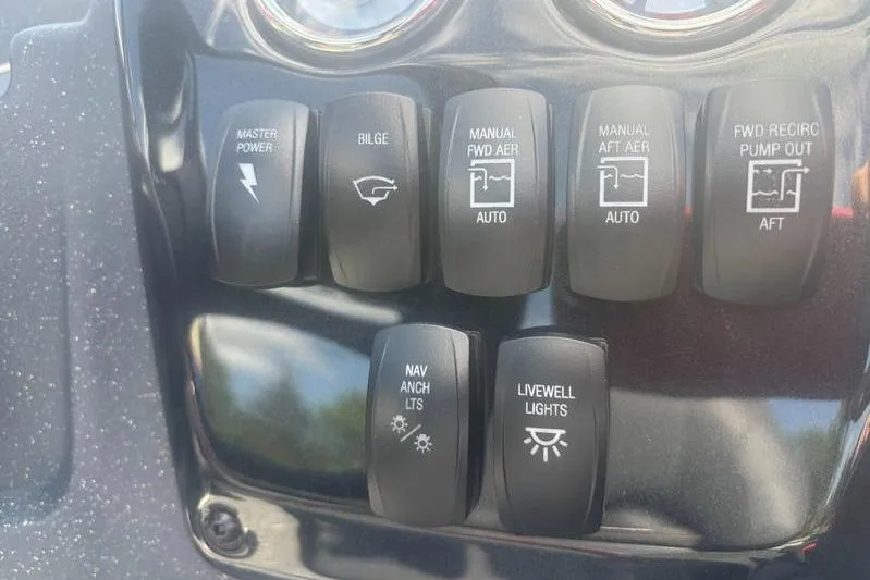Slide: The Image of Control panel of 2026 Tracker Targa V18 WT boat with various switches. - 7