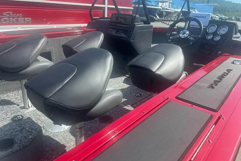 Slide: The Image of 2026 Tracker Targa V18 WT boat interior with black seats and red accents. - 8
