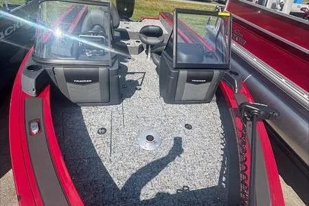 Slide: The Image of 2026 Tracker Targa V18 WT boat interior with dual consoles and seating. - 9