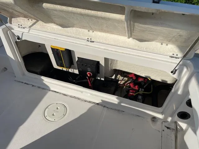 Slide: The Image of 2016 Robalo 2220 Center Console boat battery compartment with wiring and components. - 11