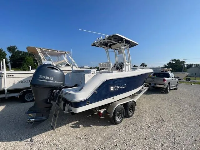 Slide: The Image of 2016 Robalo 2220 Center Console boat with Yamaha engine on a trailer. - 2