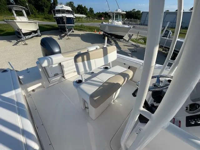 Slide: The Image of 2016 Robalo 2220 Center Console boat interior with seating and steering console. - 5
