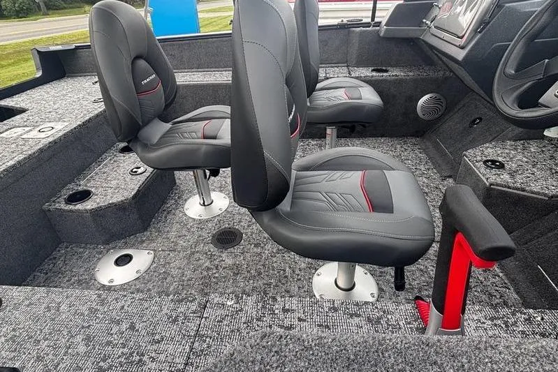 Slide: The Image of 2026 Tracker PG V175 WT boat interior with gray seats and carpeted flooring. - 11