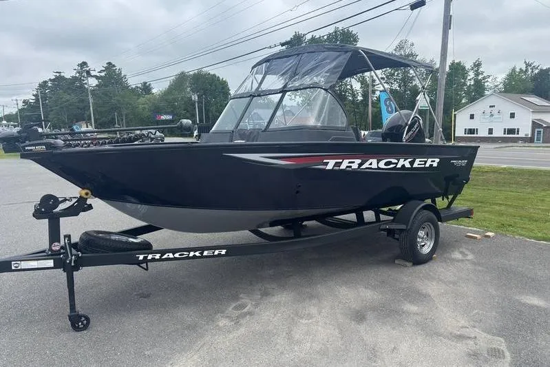 Slide: The Image of 2026 Tracker PG V175 WT boat on trailer, parked outdoors, overcast sky. - 5