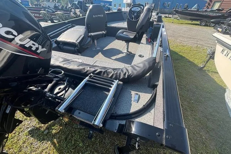 Slide: The Image of 2026 Tracker PG V175 WT boat with Mercury engine, featuring spacious seating and deck. - 6