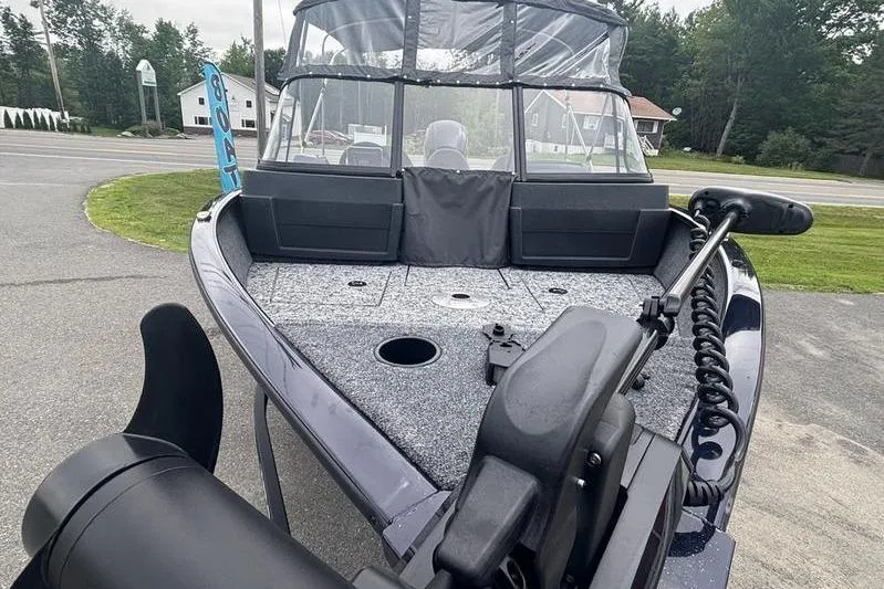 Slide: The Image of 2026 Tracker PG V175 WT boat with trolling motor on display outdoors. - 8