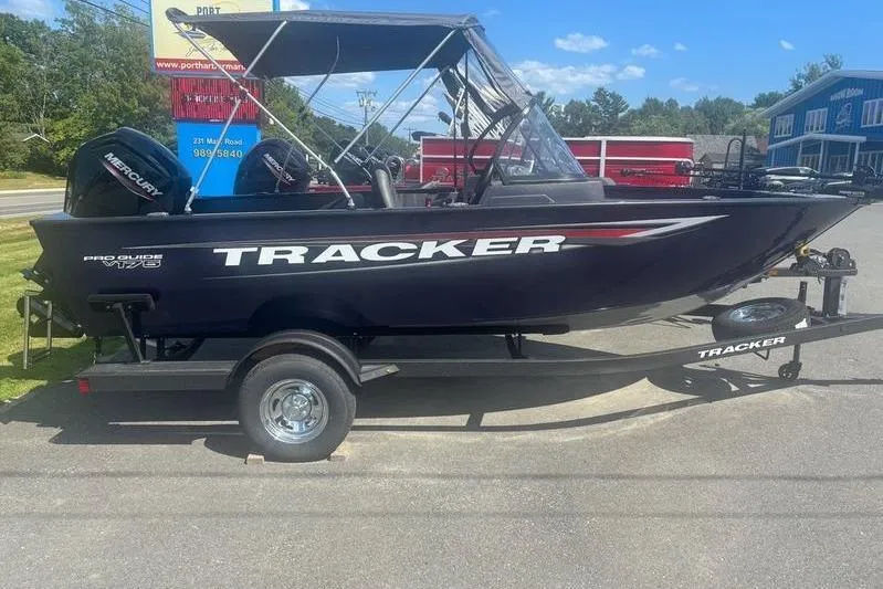 Slide: The Image of 2026 Tracker PG V175 WT boat on trailer, parked outdoors under clear sky. - 9