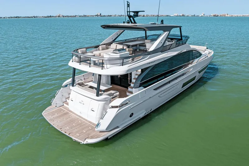 Slide: The Image of 2025 Azimut Fly 72 yacht cruising on calm blue waters. - 11