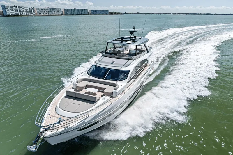 Slide: The Image of 2025 Azimut Fly 72 yacht cruising on open water, showcasing luxury and speed. - 2