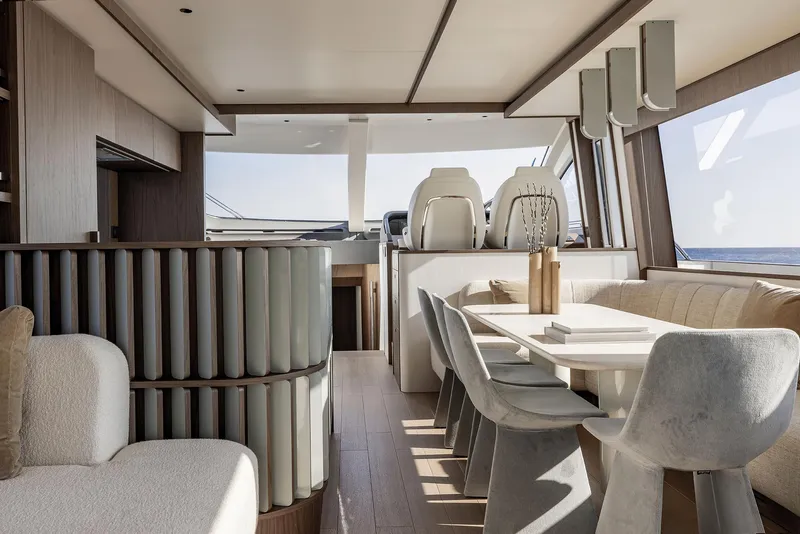 Slide: The Image of Luxurious interior of 2025 Azimut Fly 72 yacht, featuring modern dining area and elegant design. - 26
