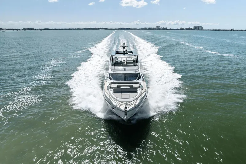 Slide: The Image of 2025 Azimut Fly 72 yacht cruising on open water, creating a dynamic wake. - 4