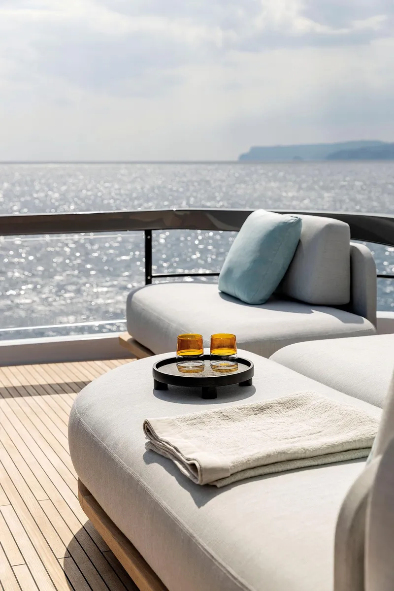 Slide: The Image of Luxurious Azimut Fly 72 yacht deck with sun loungers, ocean view, and refreshments, 2025 model. - 40