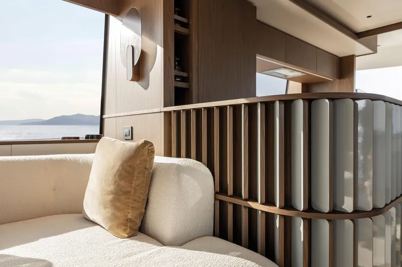 Slide: The Image of Luxurious interior of 2025 Azimut Fly 72 yacht with elegant wood and plush seating. - 49