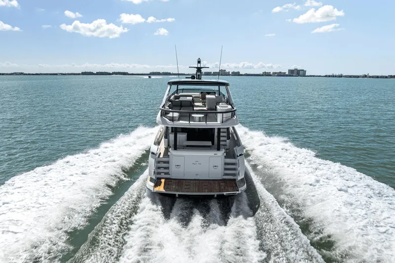 Slide: The Image of Azimut Fly 72 yacht cruising on open water, 2025 model, rear view. - 5