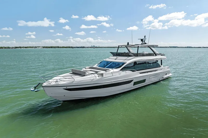 Slide: The Image of 2025 Azimut Fly 72 yacht cruising on calm waters under a clear sky. - 6