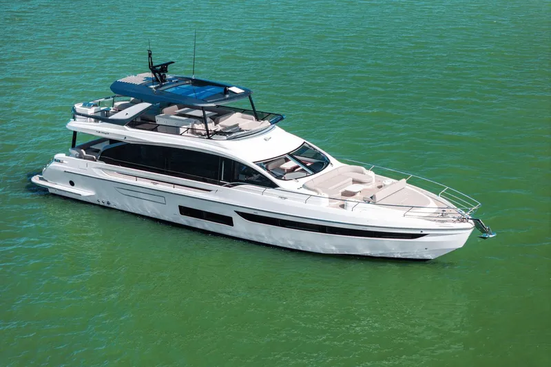 Slide: The Image of 2025 Azimut Fly 72 yacht cruising on calm green waters. - 9