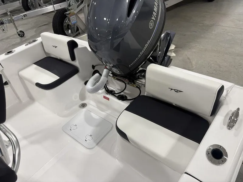 Slide: The Image of 2026 Tidewater 180 CC Adventure boat interior with Yamaha engine, featuring sleek seating and modern design. - 16