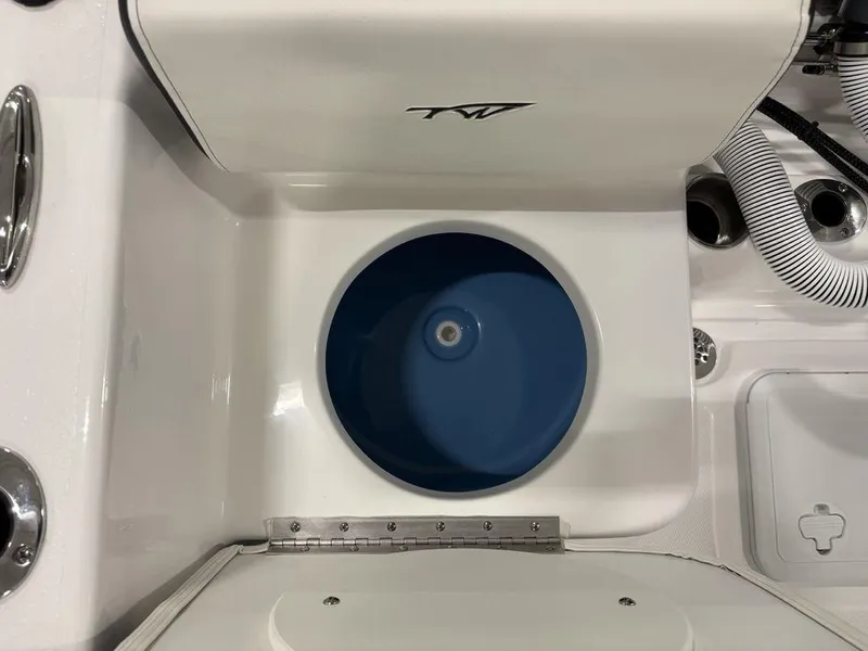 Slide: The Image of 2026 Tidewater 180 CC Adventure boat interior with blue livewell and white seating. - 21