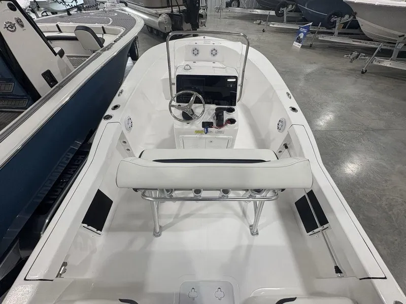 Slide: The Image of 2026 Tidewater 180 CC Adventure boat interior with steering console and seating. - 22