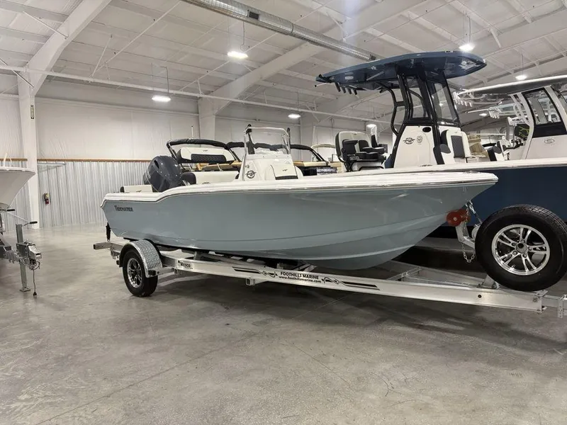Slide: The Image of 2026 Tidewater 180 CC Adventure boat on trailer in showroom setting. - 3