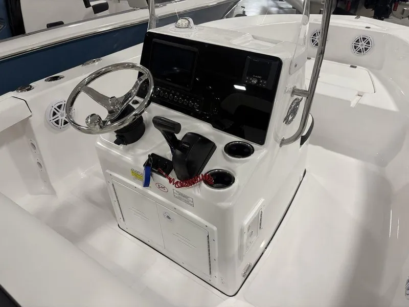 Slide: The Image of 2026 Tidewater 180 CC Adventure boat console with steering wheel and controls. - 5