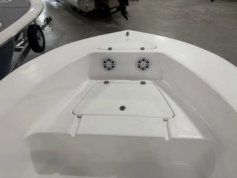 Slide: The Image of 2026 Tidewater 180 CC Adventure boat interior with storage compartment and speakers. - 6