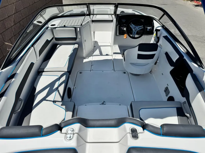 Slide: The Image of 2020 Yamaha Boats AR195 interior with sleek seating and modern dashboard design. - 10