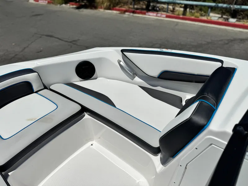 Slide: The Image of 2020 Yamaha AR195 boat interior with sleek white and black seating. - 13