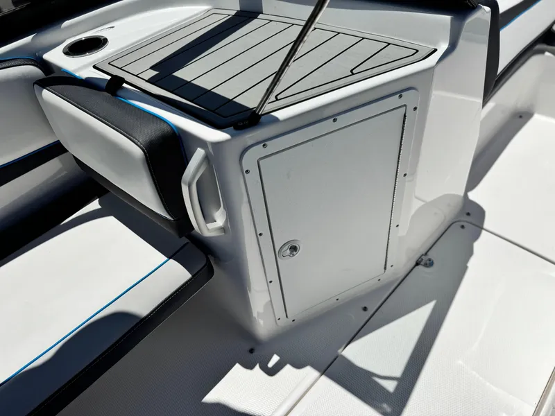 Slide: The Image of 2020 Yamaha Boats AR195 interior detail with seating and storage compartment. - 19