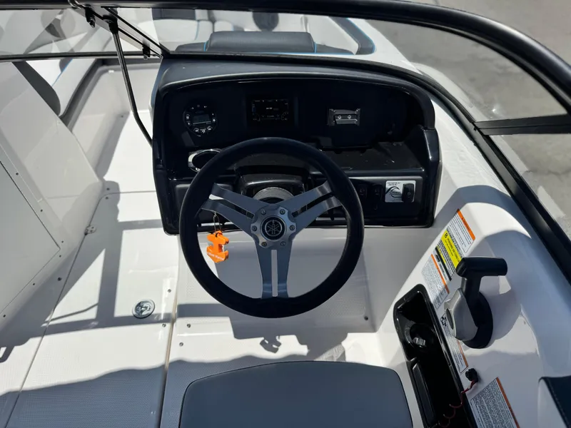 Slide: The Image of 2020 Yamaha Boats AR195 dashboard with steering wheel and control panel. - 23