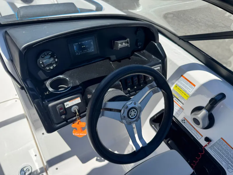 Slide: The Image of 2020 Yamaha AR195 boat dashboard with steering wheel and control panel. - 24