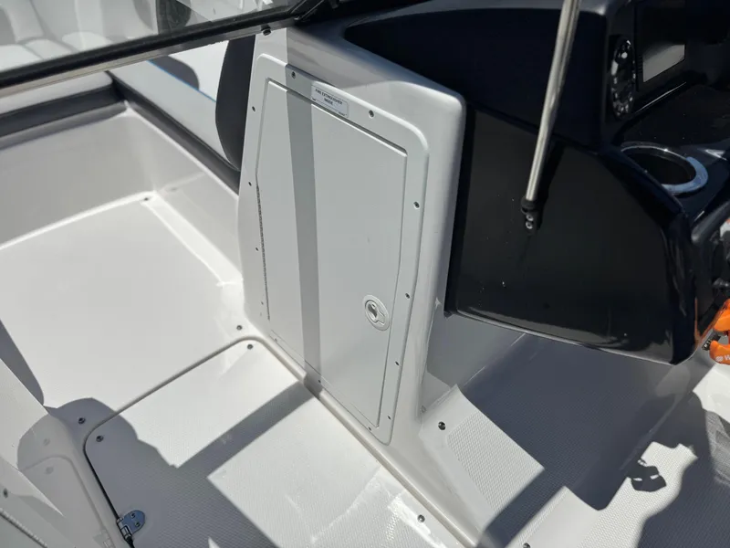 Slide: The Image of 2020 Yamaha AR195 boat interior with storage compartment and control panel. - 26
