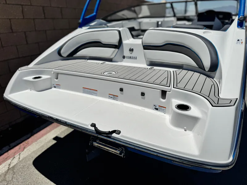 Slide: The Image of 2020 Yamaha AR195 boat rear view with sleek seating and swim platform. - 6