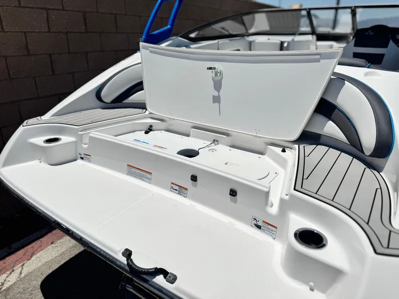 Slide: The Image of 2020 Yamaha Boats AR195 swim platform with storage compartment open. - 7