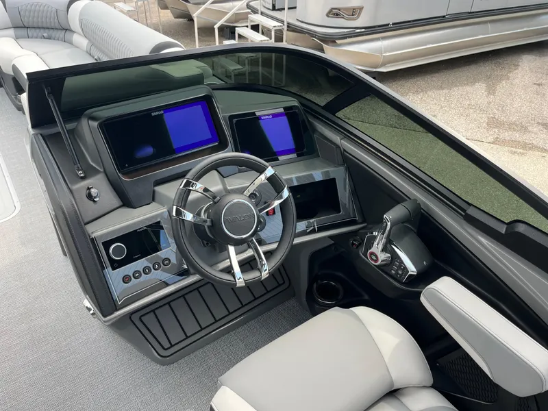 Slide: The Image of Interior of 2026 Avalon 2785 Excalibur LTD boat with modern dashboard and steering wheel. - 10