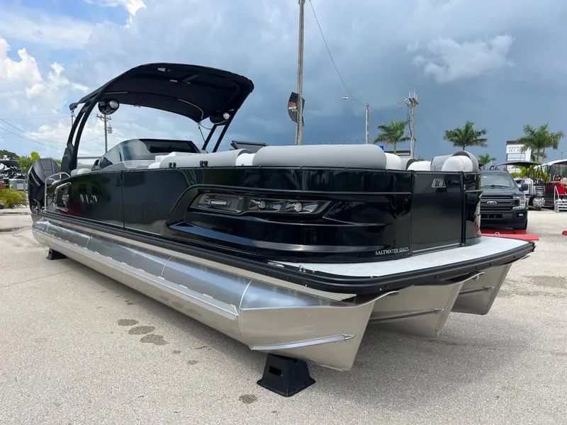 Slide: The Image of 2026 Avalon 2785 Excalibur LTD pontoon boat with twin Mercury 400hp V-10 engines, parked outdoors. - 3