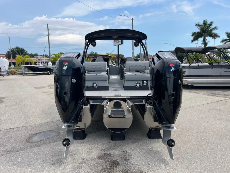 Slide: The Image of 2026 Avalon 2785 Excalibur LTD boat with twin Mercury 400hp V-10 engines, rear view. - 6